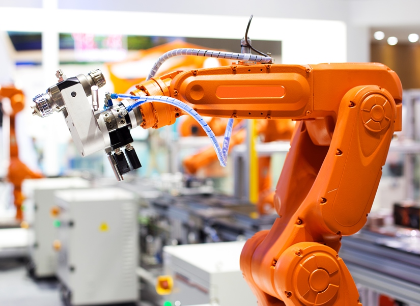 AI applications enable robot arms to safely handle objects on the production line regardless of their orientation, speed or placement. Photo by istockphoto/zhudifeng